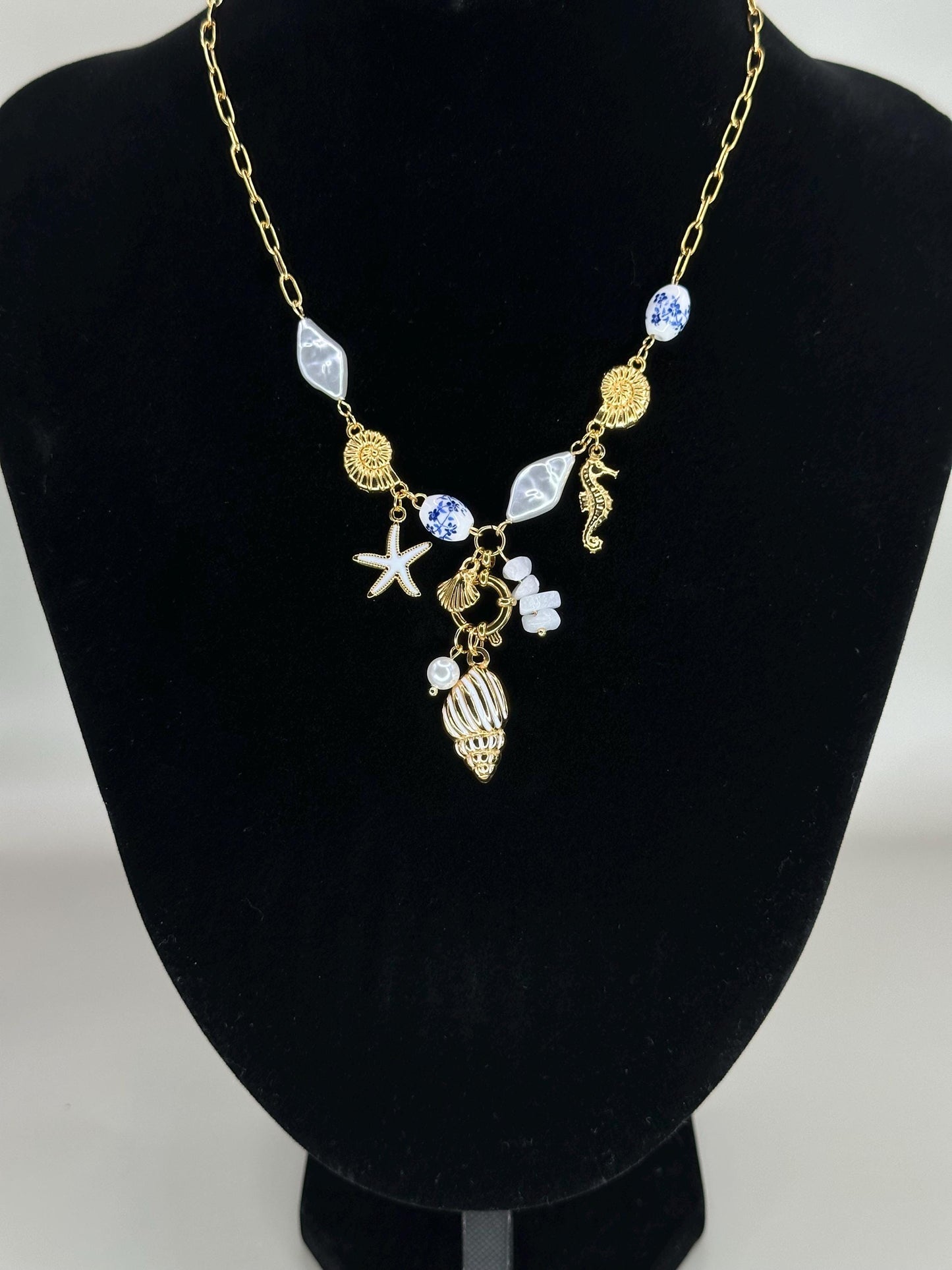 Gold Coastal Charm Necklace: Seahorse, Shells, Porcelain Bead