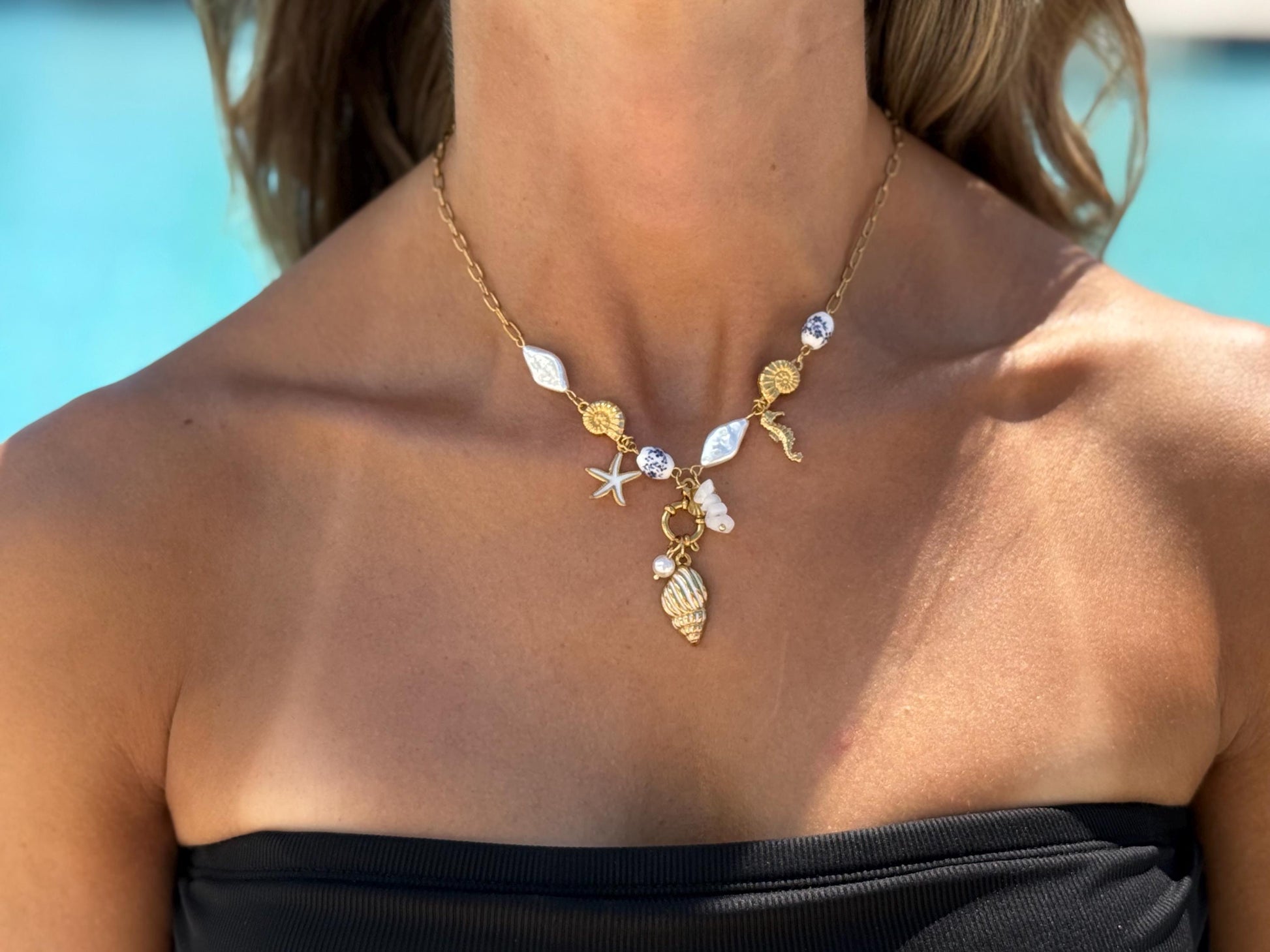 Gold Coastal Charm Necklace: Seahorse, Shells, Porcelain Bead